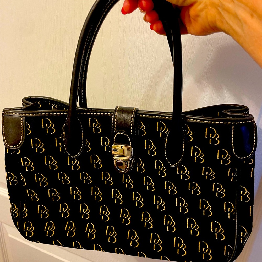 Black Dooney and Bourke handbag. Leather trim, canvass bag